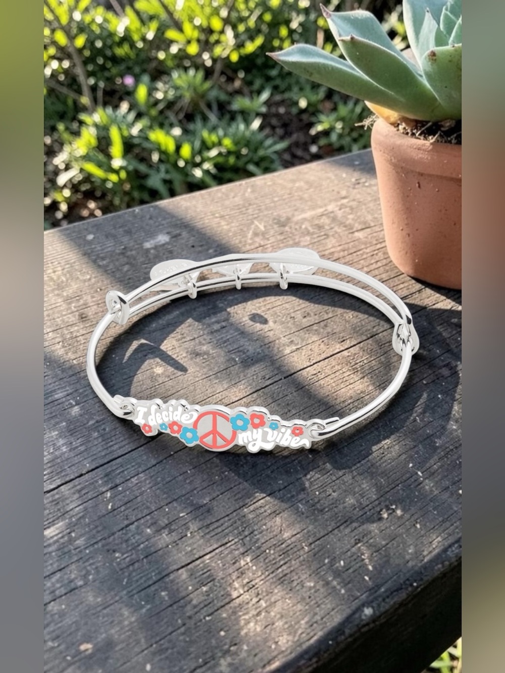 Alex and Ani Silver Bangle with Peach Peace Sign and Blue Flower Charms